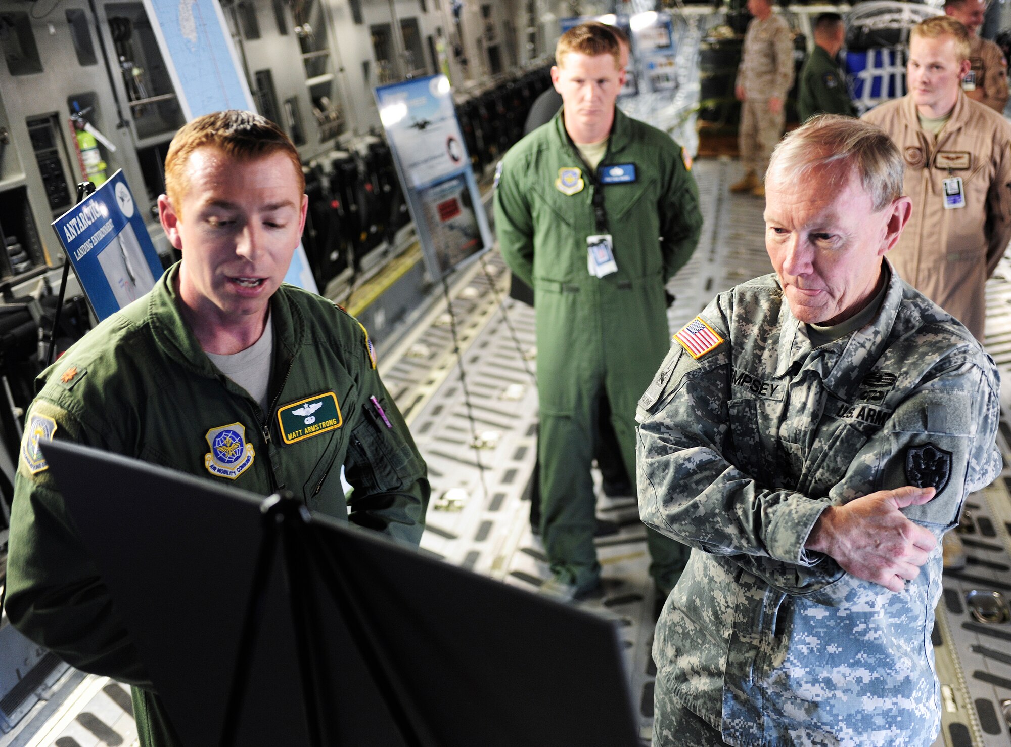 Maj. Matt Armstrong, 62nd Operations Group executive officer, briefs Army Gen. Martin Dempsey, chairman of the Joint Chiefs of Staff, Oct. 4, 2012, about McChord Field's involvement in Operation Deep Freeze, at Joint Base Lewis-McChord, Wash. The United States' most senior military official visited JBLM to get a better understanding of the various missions performed by McChord Field Airmen. (U.S. Air Force photo/Staff Sgt. Sean Tobin)
