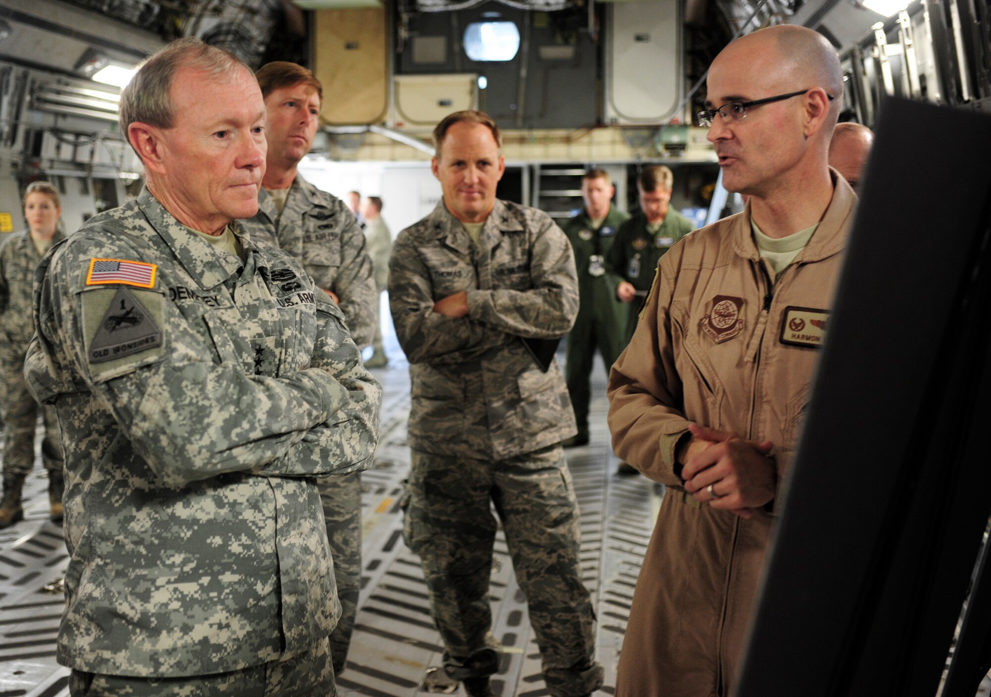 Lt. Col. Harmon Lewis, 8th Airlift Squadron commander, explains the Joint Precision Airdrop System to Army Gen. Martin Dempsey, chairman of the Joint Chiefs of Staff, Oct. 4, 2012, at Joint Base Lewis-McChord, Wash. JPADS is an airdrop system that uses global positioning satellites and steerable parachutes to achieve more accuracy when airdropping loads within a drop zone. (U.S. Air Force photo/Staff Sgt. Sean Tobin)