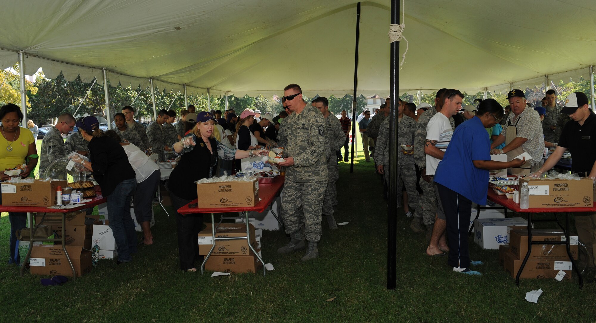 Members from the local community hand out food to Airmen and their families during Celebrate Barksdale on Barksdale Air Force Base, La., Oct. 5. The 16th annual event is hosted by the Shreveport-Bossier Military Affairs council and gives the local community a chance to show their appreciation for the military. More than 800 participants attended the annual celebration. (U.S. Air Force photo/Airman 1st Class Benjamin Gonsier)(RELEASED)
