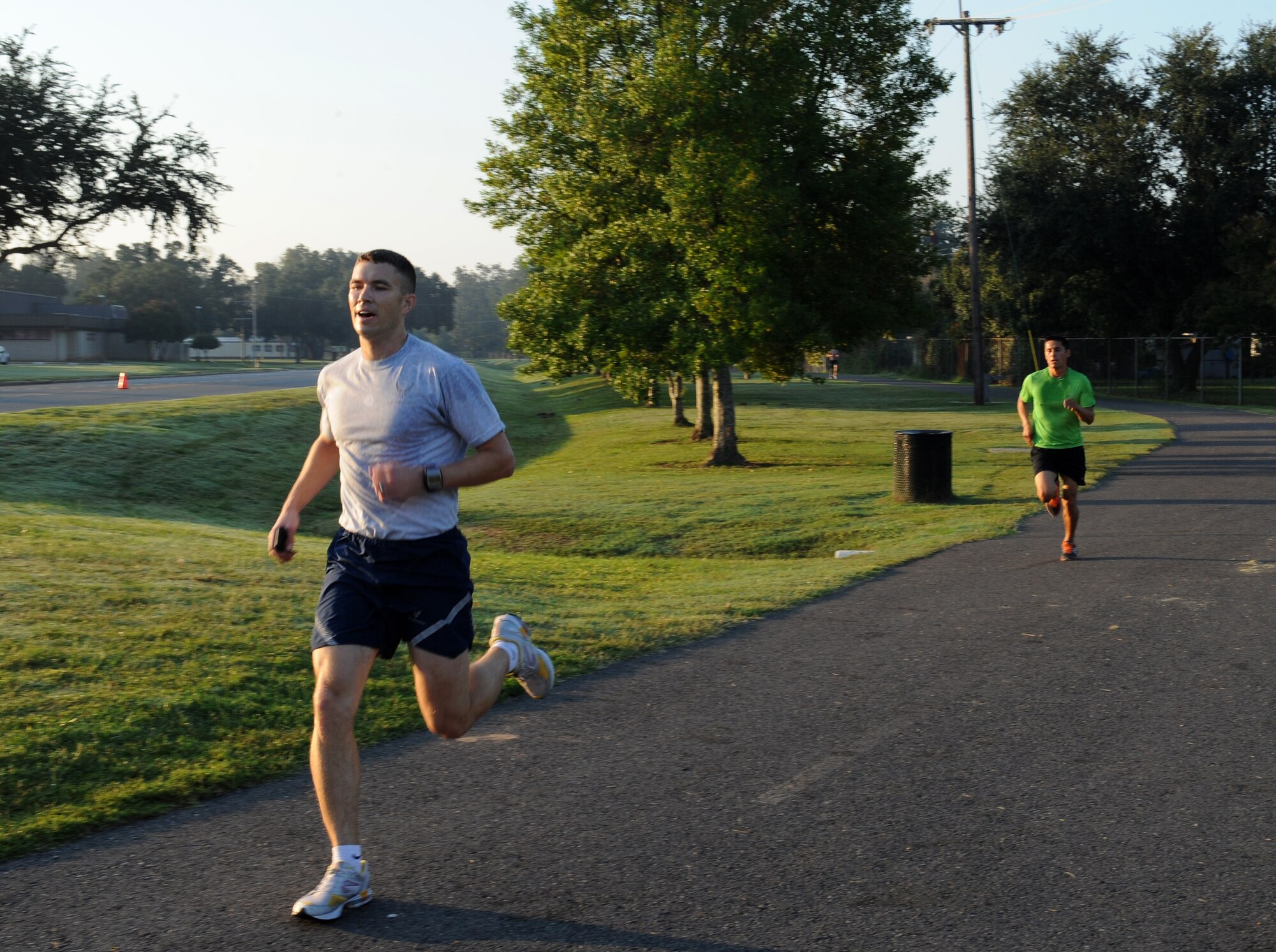 Maj. Warren Carroll, 11th Bomb Squadron, and Master Sgt. Randall Kingfisher, Air Force Global Strike Command, complete the Celebrate Barksdale fun run on Barksdale Air Force Base, La., Oct. 5. Carroll and Kingfisher received medals by finishing the Celebrate Barksdale fun run first and second respectively. (U.S. Air Force photo/Airman 1st Class Benjamin Gonsier)(RELEASED)
