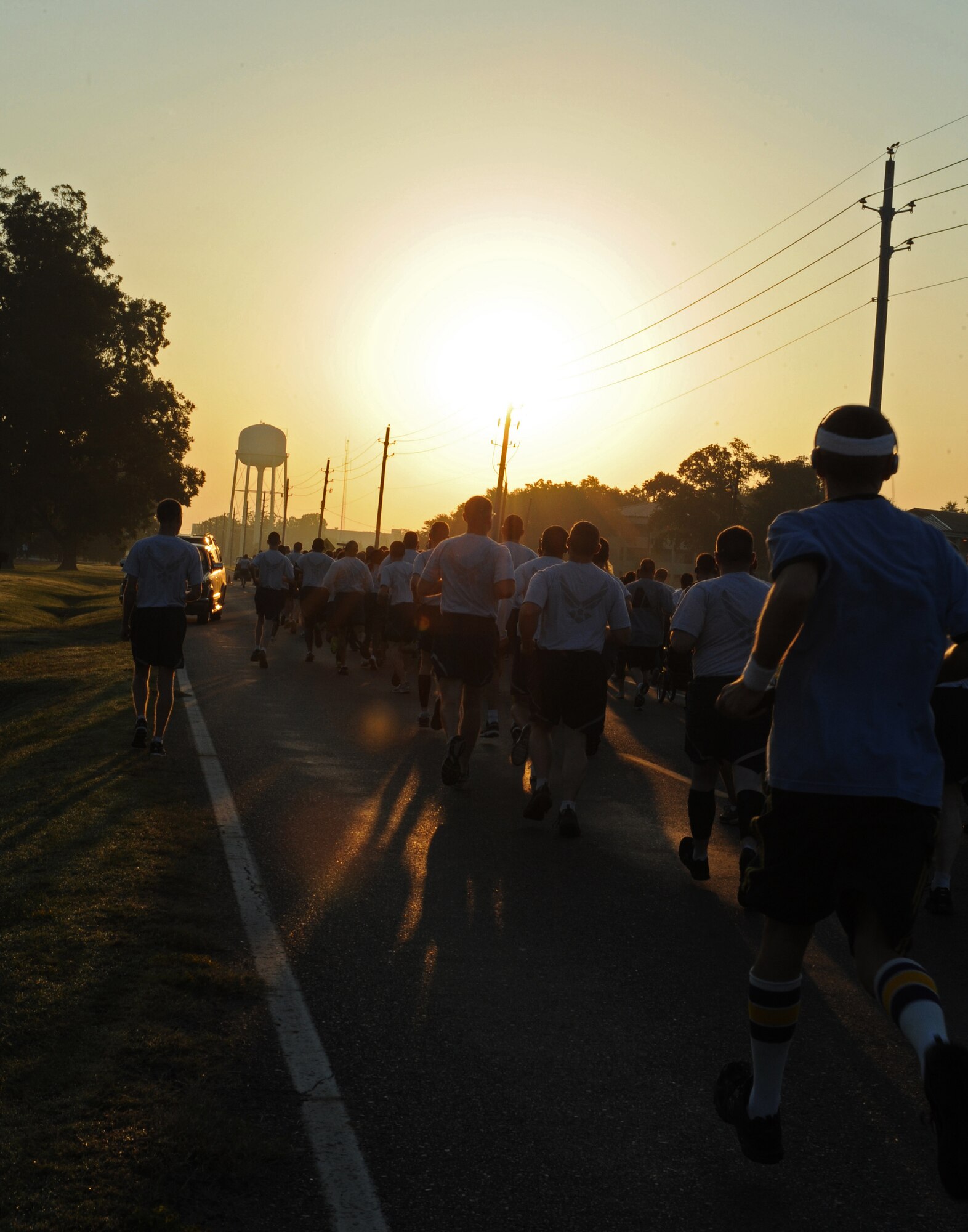 The sun rises as members of Team Barksdale participate in the Celebrate Barksdale fun run on Barksdale Air Force Base, La., Oct. 5. Celebrate Barksdale is an annual event sponsored by the Shreveport-Bossier Military Affairs Council. The event gives the MAC and members of the local community a chance to show appreciation for Team Barksdale. (U.S. Air Force photo/Airman 1st Class Benjamin Gonsier)(RELEASED)
