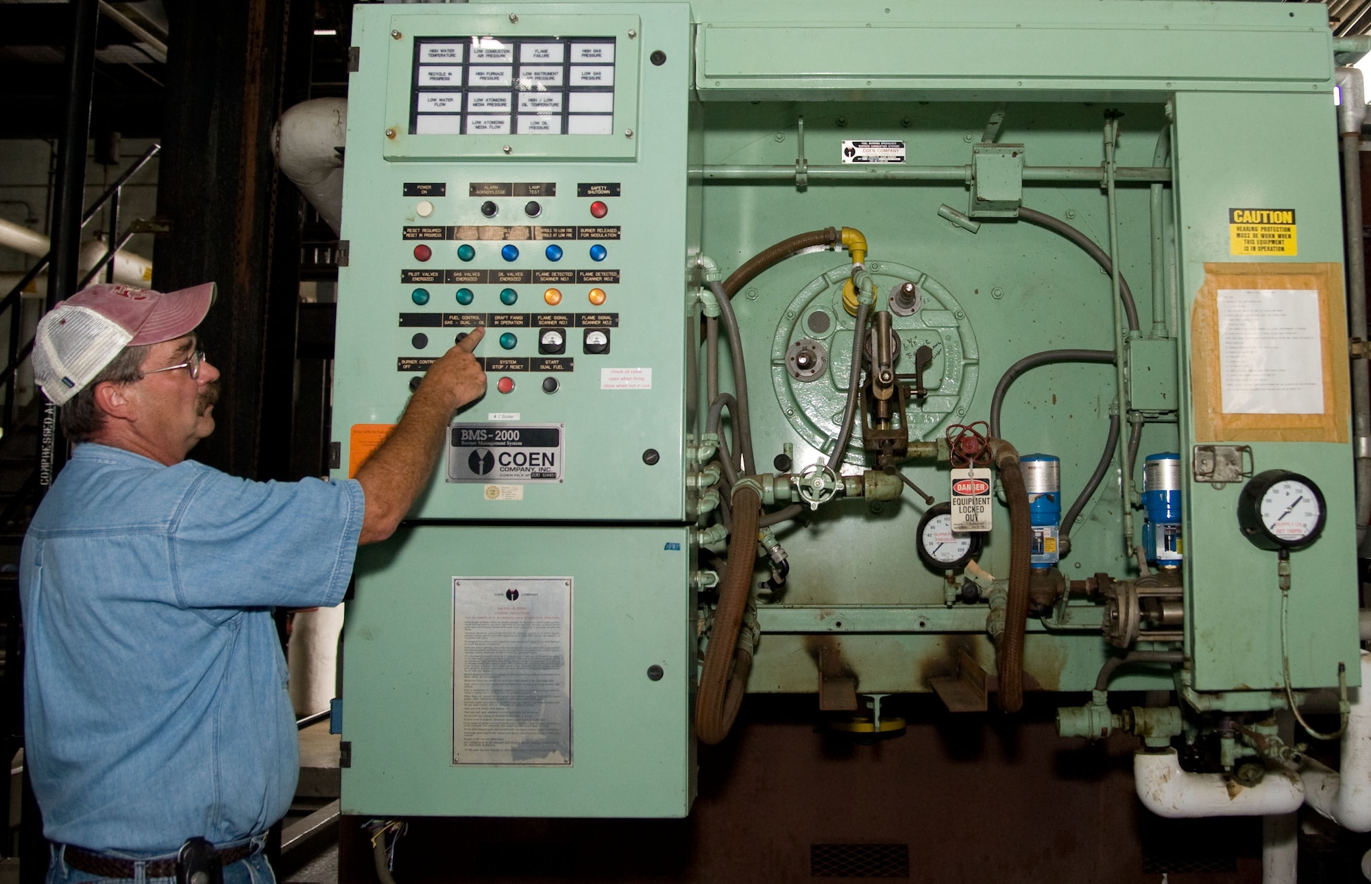Bobbie Grimes inspects a boiler at the Dover Air Force Base, Del. heat plant Oct. 4, 2012. The heat plant, which has been in operation since 1954, is scheduled for demolition in the coming months. (U.S. Air Force photo by Adrian R. Rowan)