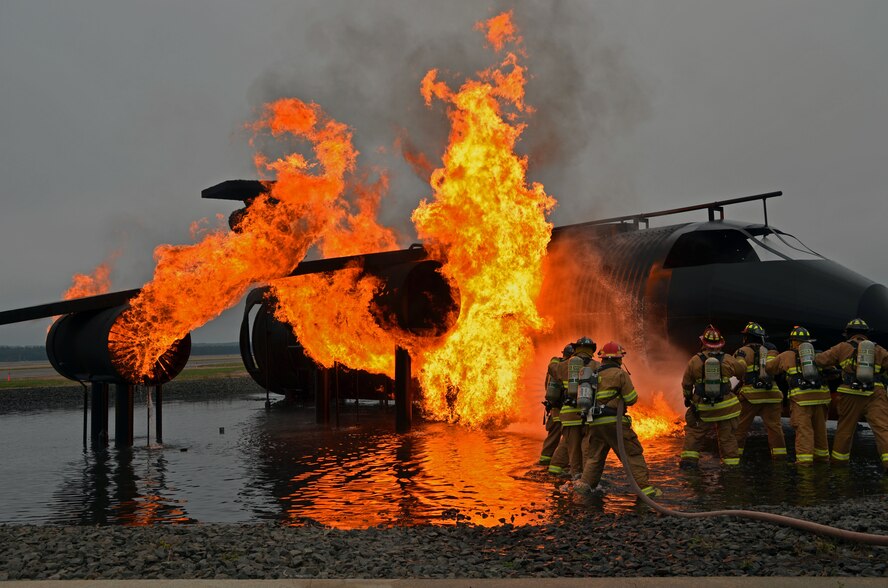Westover's Fire Dept. trains with firefighters from the Chicopee Fire Dept. on procedures and technique when extinguishing aircraft fires. Westover's "Miss Piggy" simulates a variety of aircraft fires essential for firefighter training. (U.S. Air Force photo by SrA. Kelly Galloway)