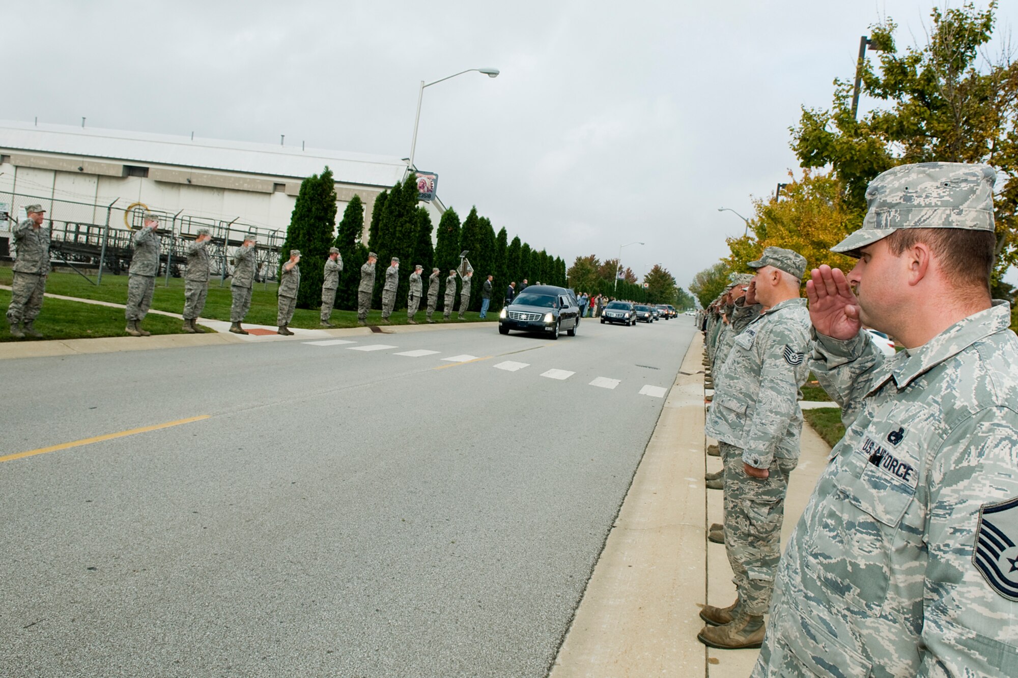 GRISSOM AIR RESERVE BASE, Ind. -- Military and civilian personnel from Grissom line the streets and pay their respects to Sgt. Bradley Atwell, a fallen Hoosier Marine, Sept. 28. Atwell, 27, lost his life Sept. 15 while supporting combat operations at Camp Bastion in Helmand Province, Afghanistan. (U.S. Air Force photo/Staff Sgt. Benjamin Mota)
