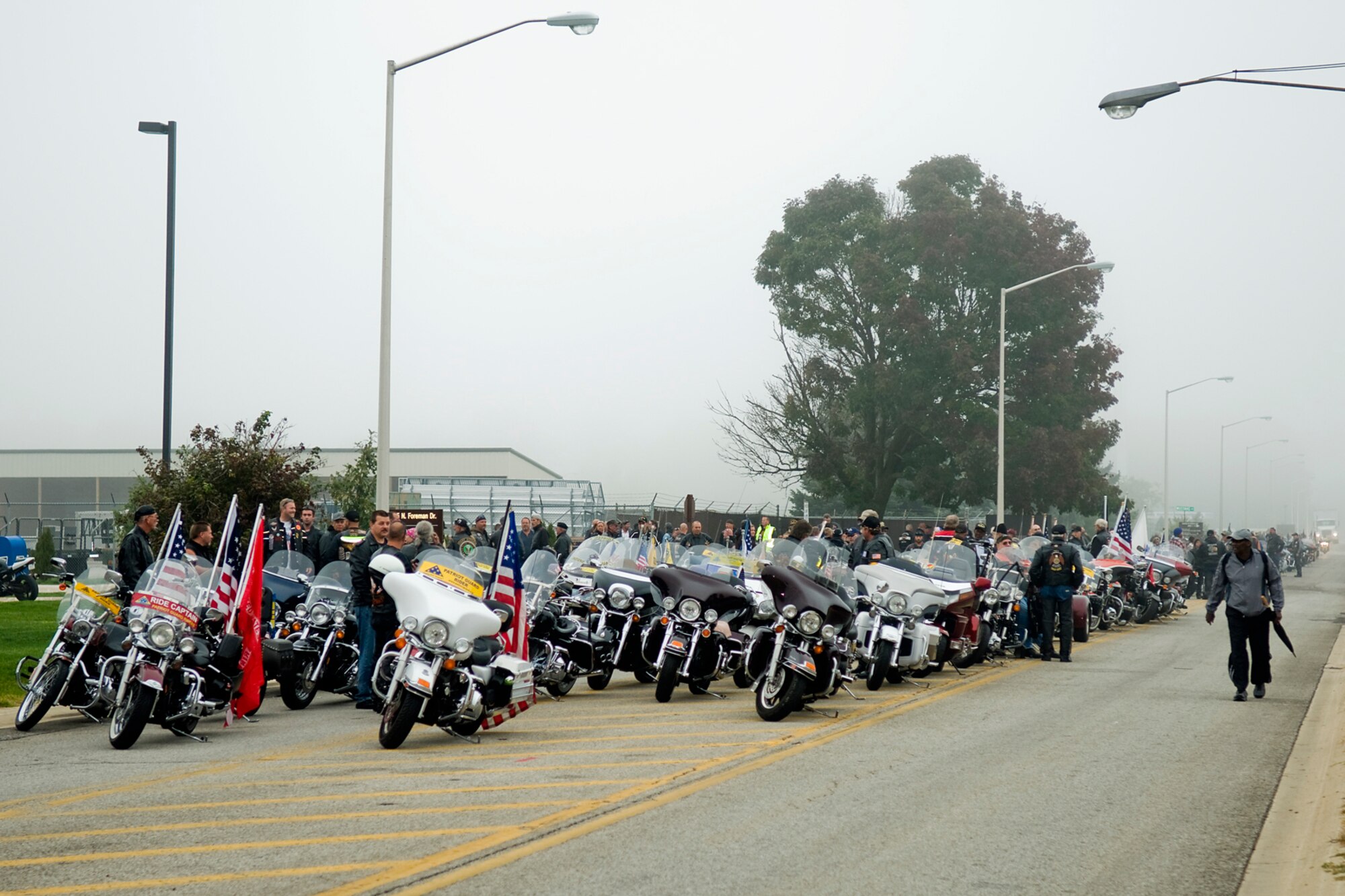 GRISSOM AIR RESERVE BASE, Ind. -- Approximately 300 Patriot Guard Riders and emergency response vehicles lined up outside Grissom Sept. 28 to escort a fallen Hoosier Marine to his final resting place in Kokomo, Ind. Patriot Guard Riders attend funeral services of fallen servicemembers as invited guests of the family to show respect for the fallen and to shield the mourning family and their friends from interruptions created by any protestor or group of protestors. (U.S. Air Force photo/Staff Sgt. Benjamin Mota)
