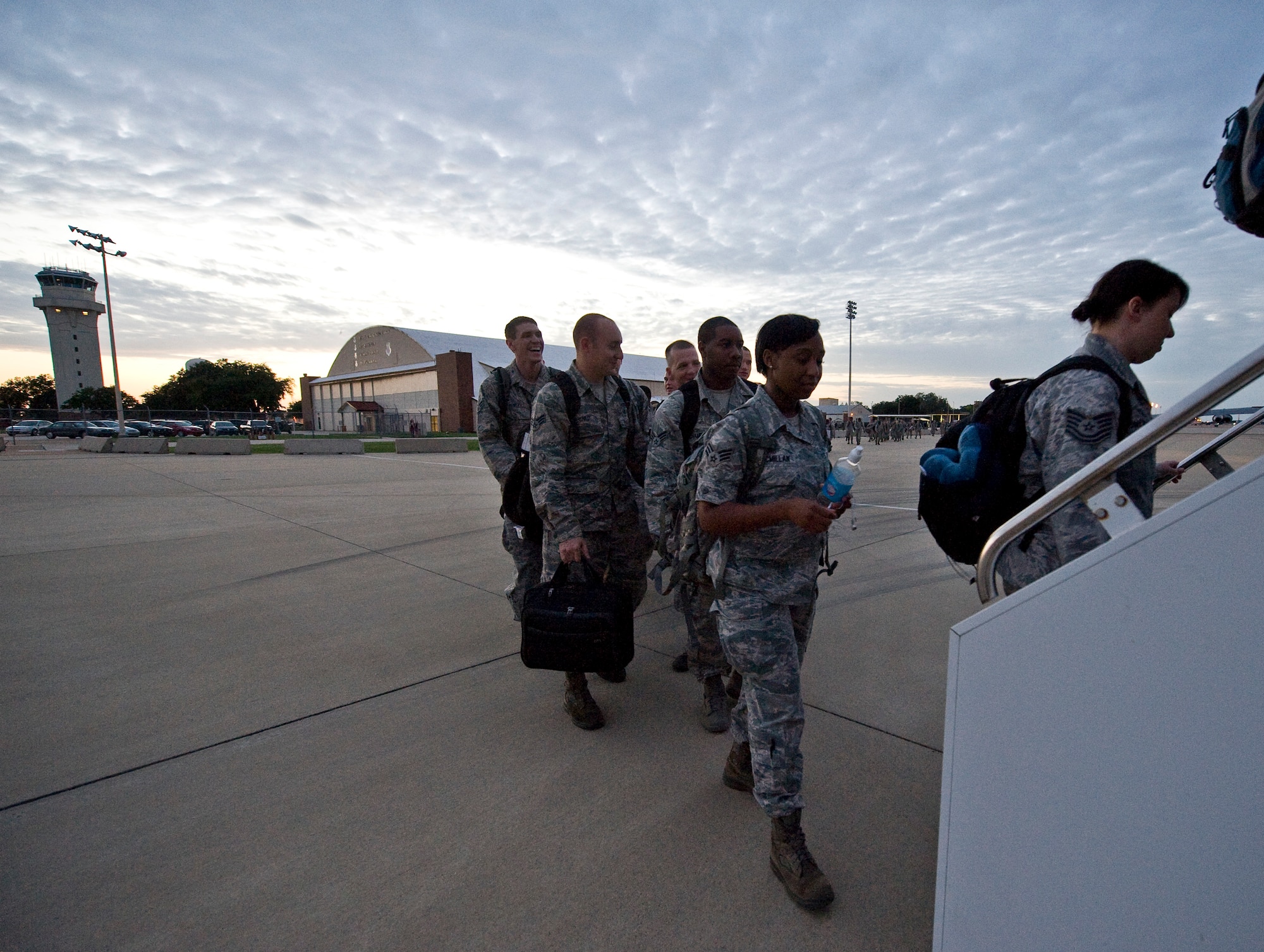Airmen from the 96th Bomb Squadron board a flight to Guam for a deployment from Barksdale Air Force Base, La., Oct 1. The Airmen are deploying in support of the continuous bomber presence in the pacific, a standing Air Force Global Strike Command deterrence mission. This is the first group of Airmen from Barksdale who are deploying for a six-month rotation as opposed to four months as it has been in the past. (U.S. Air Force photo/Staff Sgt. Chad Warren)(RELEASED)