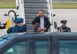 President Barack Obama salutes as he descends the stairs of Air Force One, at Truax Field, Madison, Wisc., October 4, 2012. The President visted the base prior to speaking at Bascom Hill on the University of Wisconsin-Madison campus. (U.S. Air Force photo by Tech Sgt. Ashley Bell)