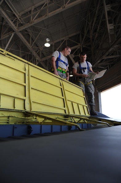 Tech. Sgt. Robert Lefors and Staff Sgt. Michael Dickerson, 2nd Maintenance Group Quality Assurance Office, inspect a B-52H Stratofortress rudder on Barksdale Air Force Base, La., Oct. 2. Due to cracks found during a phase inspection, Airmen from the 2nd Maintenance Squadron removed and replaced the B-52s rudder. The B-52 provides the backbone of the bomber force with the ability for global attack and precision engagement. (U.S. Air Force photo/Senior Airman Micaiah Anthony)(RELEASED)