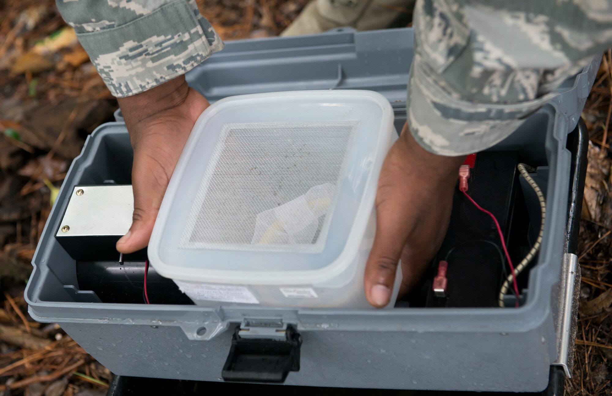 U.S. Air Force Tech. Sgt. Charles Dantzler, 23d Civil Engineer Squadron pest management NCO in charge, assembles a mosquito trap at Moody Air Force Base, Ga., Oct. 3, 2012. The container is used to secure the mosquitoes and prevent them from escaping. (U.S. Air Force photo by Senior Airman Douglas Ellis/Released)
