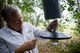 Rick Gilbridge, 23d Civil Engineer Squadron entomologist, sets a dry ice-infused mosquito trap at Moody Air Force Base, Ga., Oct. 3, 2012.  The mosquitoes are attracted to the carbon dioxide from the ice. The trap then uses a fan to suck the attracted mosquitoes into a net. (U.S. Air Force photo by Senior Airman Douglas Ellis/Released) 
