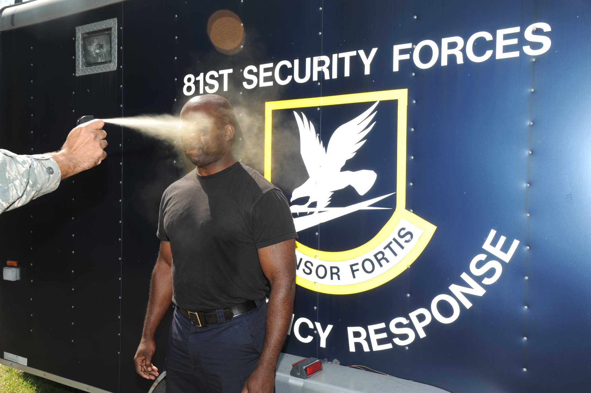 Officer Michael Goodman, 81st Security Forces Squadron, receives a spray of oleoresin capsaicin during OC spray training Sept. 3, 2012, at Keesler Air Force Base, Miss.  The training is a required one-time exposure of the OC spray for all Security Forces members.  (U.S. Air Force photo by Kemberly Groue)