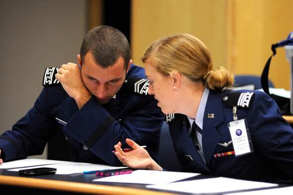 Cadet 2nd Class Michael Whiteside and Cadet 1st Class Harriet Randolph confer at the Air Force Academy's 50th Forensics Classic Sept. 22, 2012. The tournament brought together nearly 300 competitors from 29 colleges in 18 states. (U.S. Air Force photo/Mike Kaplan)