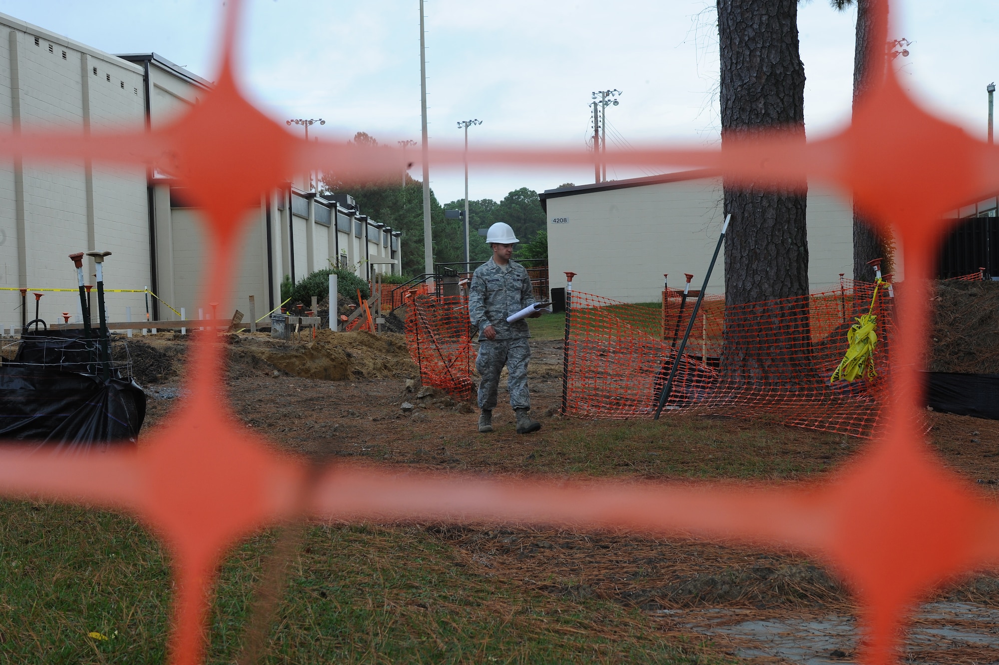U.S. Air Force Senior Airman Andrew Hostetter, 4th Contracting Squadron contract specialist, inspects a construction site on Seymour Johnson Air Force Base, N.C., Oct. 3, 2012. Contracting specialists check construction areas to view contractor’s progress throughout the course of a project. (U.S. Air Force photo/Airman 1st Class John Nieves Camacho/Released)