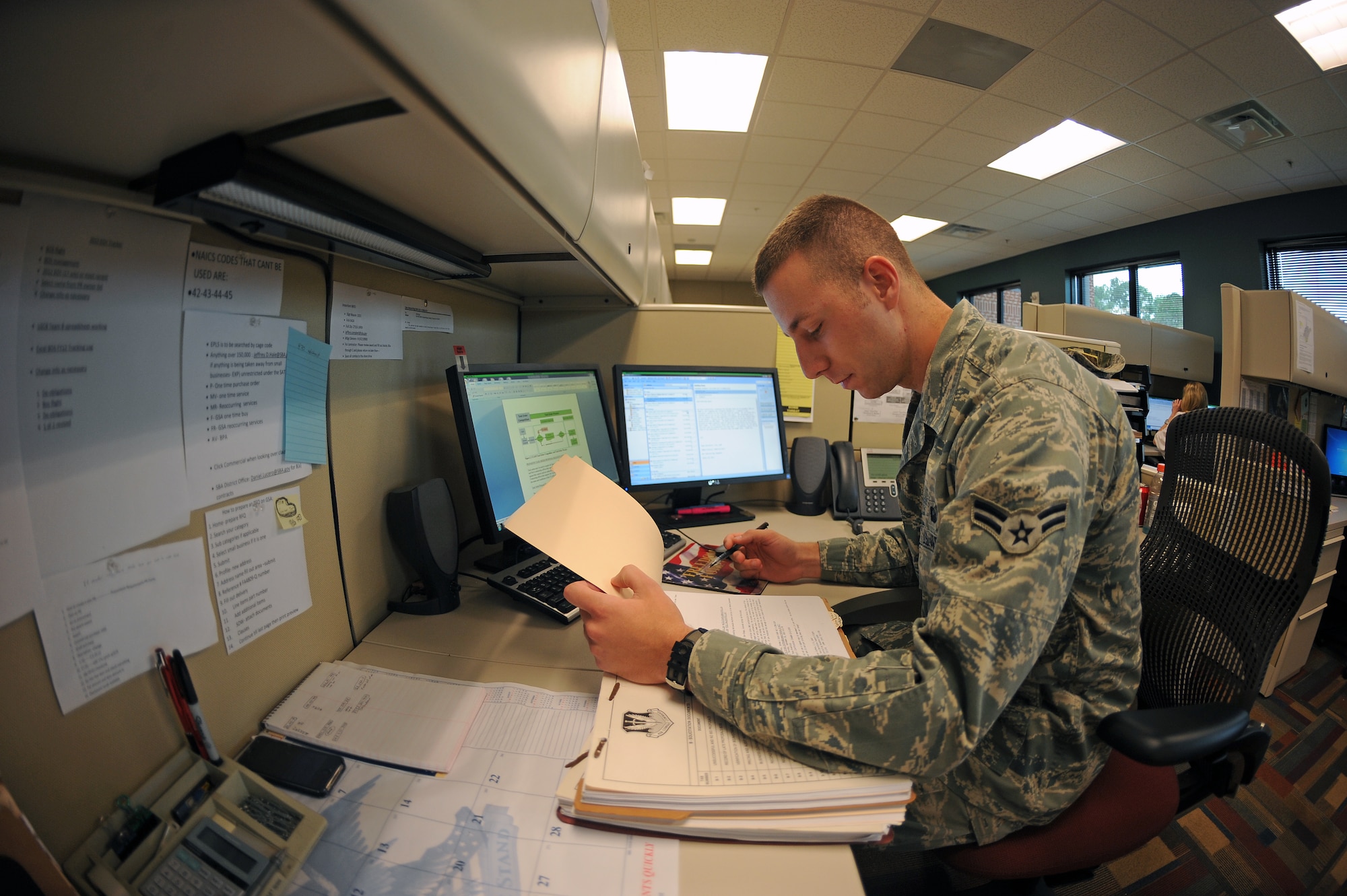 U.S. Air Force Airman 1st Class Brett Etter, 4th Contracting Squadron contract specialist, reviews a contract for discrepancies on Seymour Johnson Air Force Base, N.C., Oct. 3, 2012. The 4th CONS awarded $54 million to be spent on infrastructure repair during fiscal year 2012, the most ever spent on construction since 1957. (U.S. Air Force photo/Airman 1st Class John Nieves Camacho/Released)