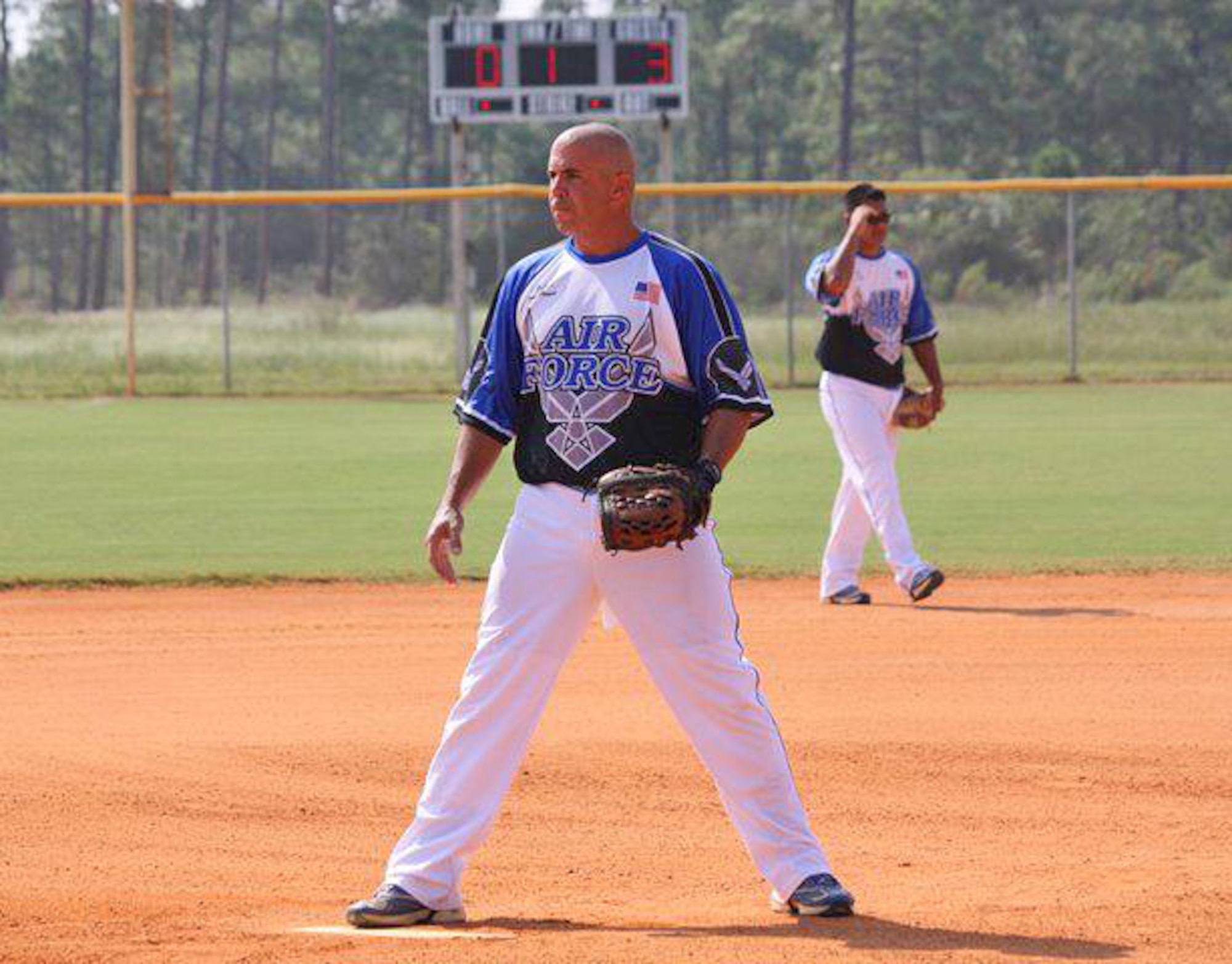 Master Sgt. Tony Patrick, 4th Equipment Maintenance Squadron NCO in charge of munitions inspections, warms up prior to an Air Force men's softball game. Patrick typically pitches for his teams but also plays shortstop. (Courtesy Photo)