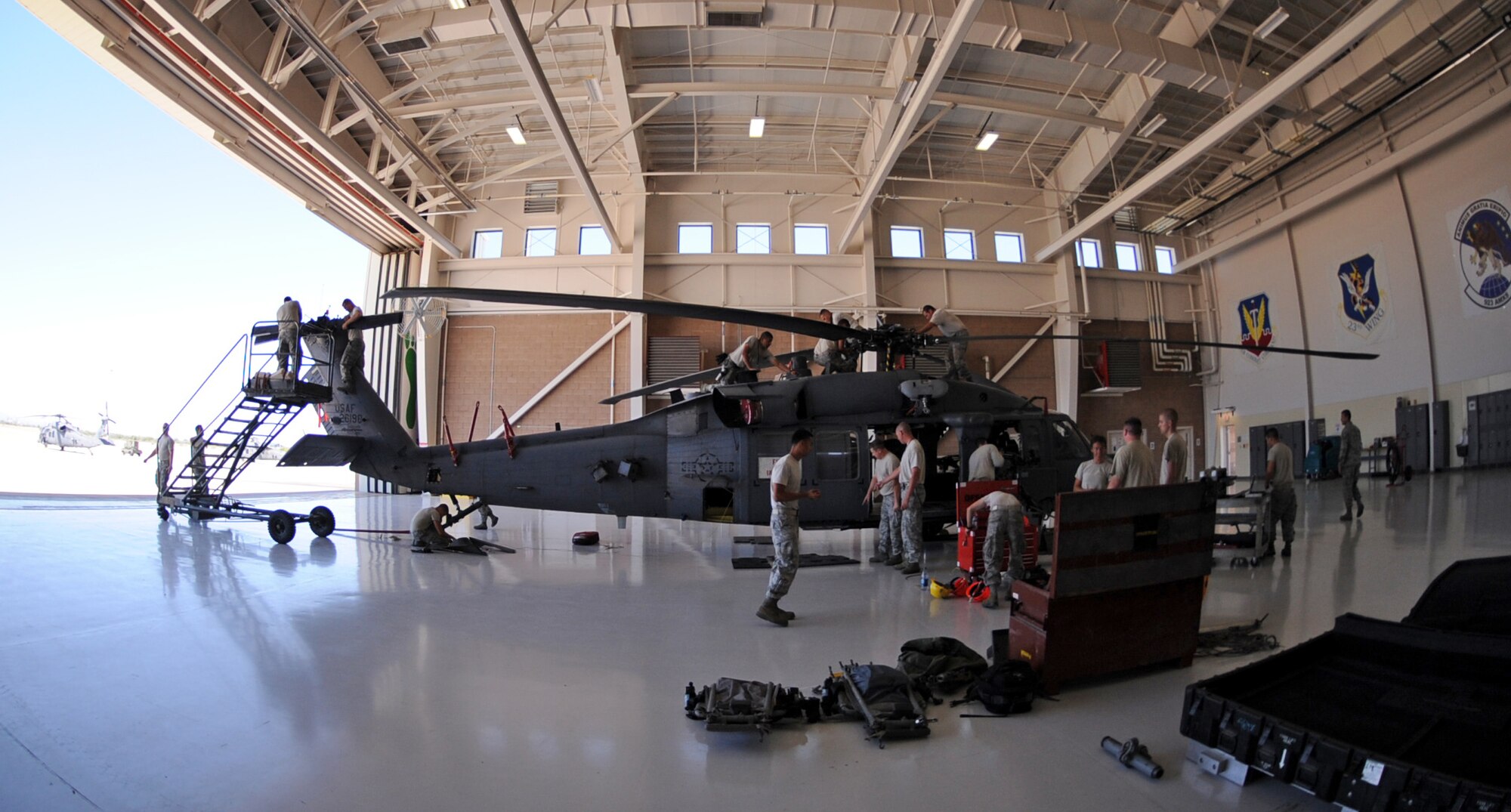 U.S. Air Force Airmen from the 923rd Maintenance Squadron, break down an HH-60 helicopter at the 55th Rescue Squadron hangar on Davis-Monthan Air Force Base, Ariz., Sept. 19, 2012. (U.S. Air Force photo by Airman 1st Class Christine Griffiths/Released) 