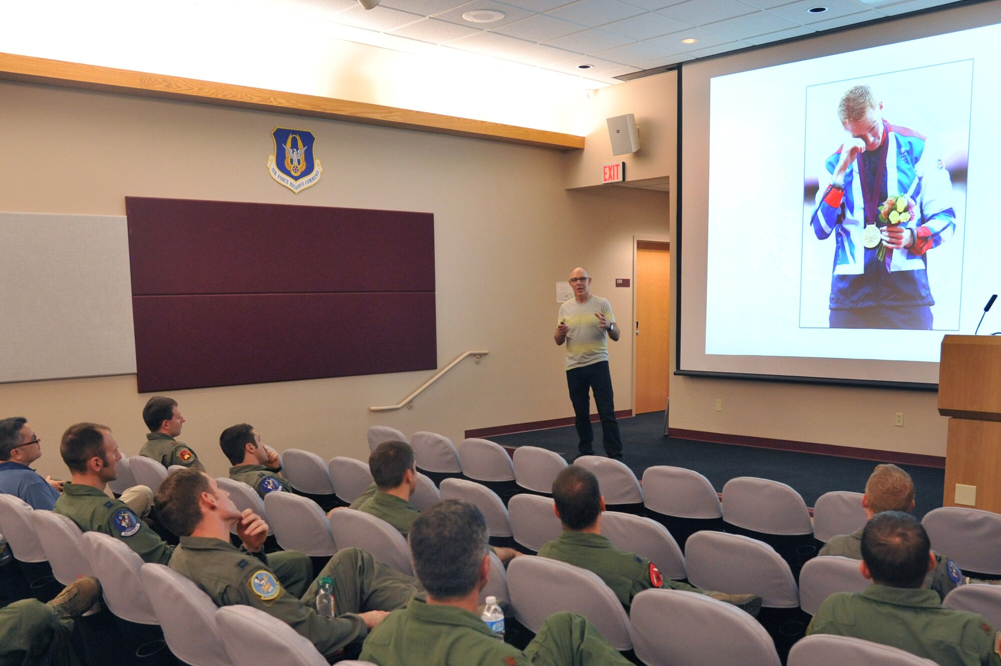 Dr. Jeff Spencer, olympian and author, speaks to the Luke Air Force Base community Sept. 26 at the 69th Fighter Squadron. Spencer spoke about the Champion’s Blueprint for peak performance, his personal method, and suggested series of tactics people should learn to get to the top, stay there and thrive in an ever-changing world.  (U.S. Air Force photo by Senior Airman Sandra Welch)