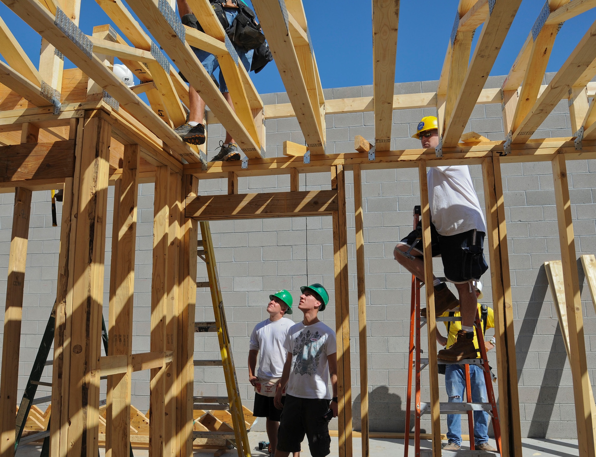 Members of the 607th Air Control Squadron assist Habitat for Humanity in building a home for a family in need Sept. 14 in Peoria.  (U.S. Air Force photo by Staff Sgt. Darlene Seltmann)