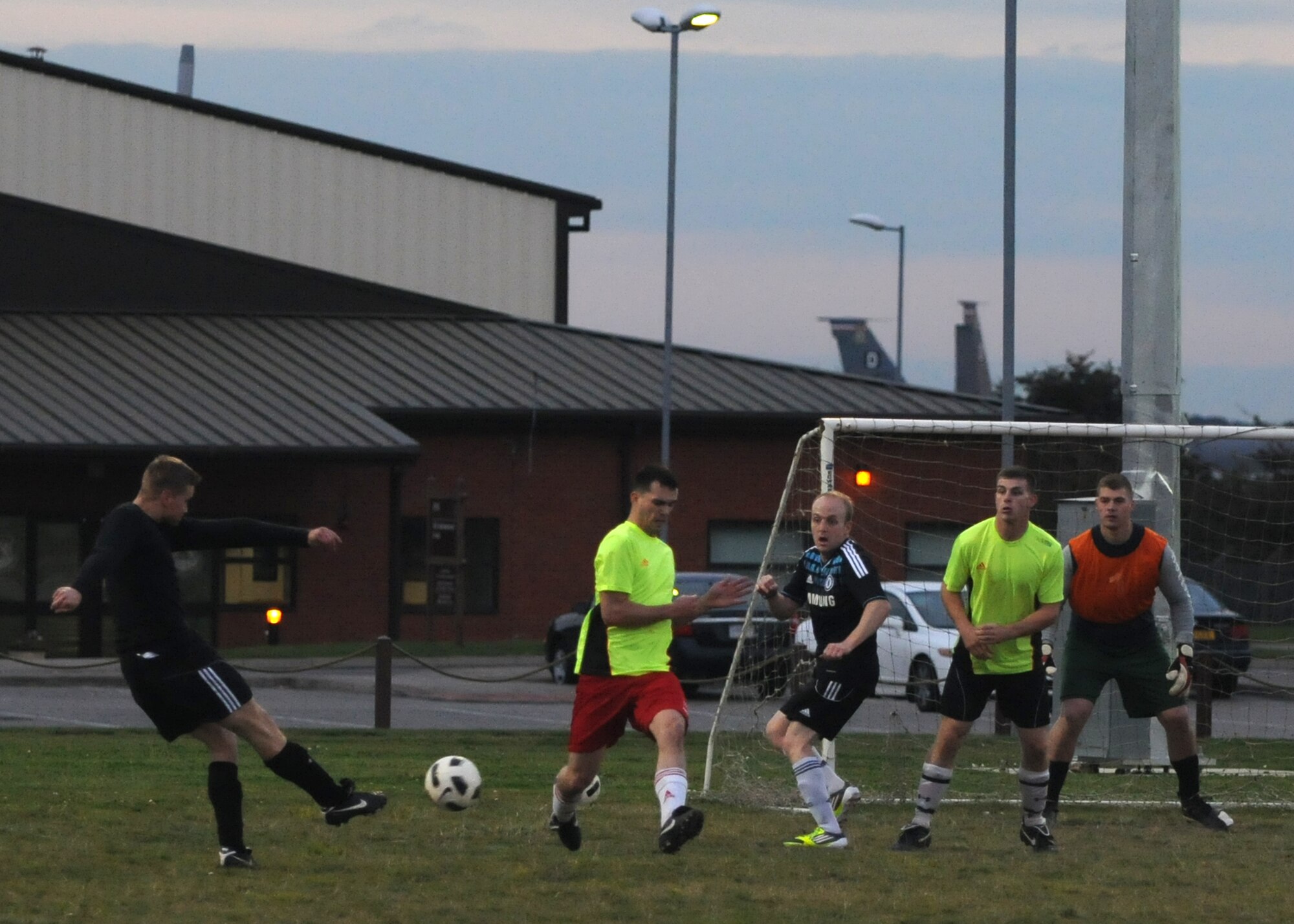 Senior Airman Justin Wood, 100th Security Forces Squadron, scores a goal for his team during the first of two soccer matches against the 100th Civil Engineer Squadron Oct. 4, 2012, at RAF Mildenhall, England. The final score of each match was 2 to 1 with the 100th SFS sweeping both games to claim the title of Team Mildenhall intramural soccer champions. (U.S. Air Force photo by Tech. Sgt. Neal X. Joiner/Released) 