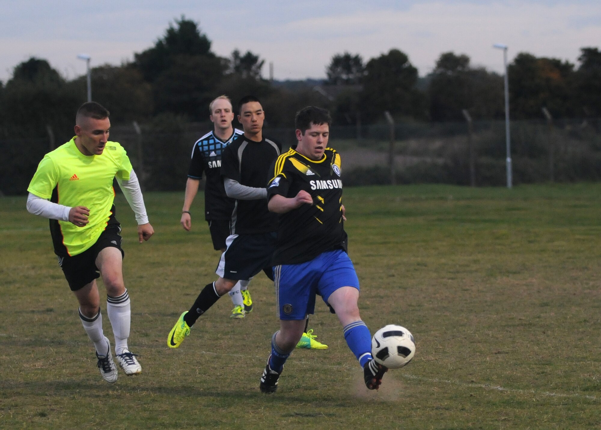 Airman Kenneth Gonzalez, 100th Security Forces Squadron, runs the ball downfield during the first of two soccer matches Oct. 4, 2012, at RAF Mildenhall, England. The matches determined the winner of the Team Mildenhall Intramural Soccer championship and resulted in a clean sweep by the 100th SFS to claim the trophy. (U.S. Air Force photo by Tech. Sgt. Neal X. Joiner/Released)