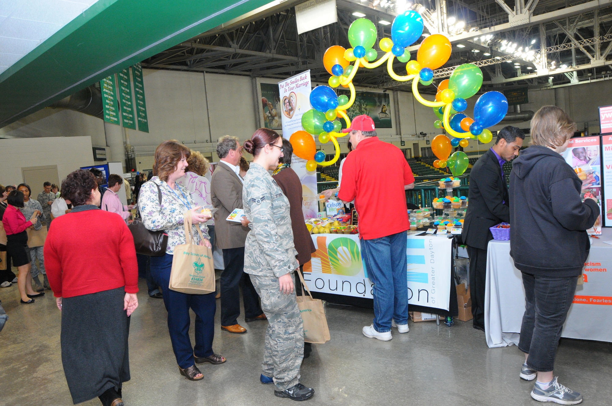 Attendees at the launch of the 2012 Miami Valley Combined Federal Campaign at the Nutter Center Oct. 3 check out the exhibits from the 140 charities participating in the event.  (photo by Niki Jahns)