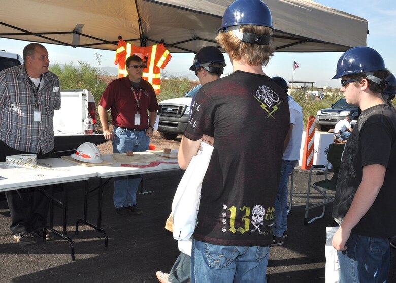 PHOENIX - Kevin Thomas (left), chief of the Construction Support Branch at the U.S. Army Corps of Engineers Los Angeles District’s Arizona/Nevada Area office in Phoenix and Nick Erwin, a District intern, speak with high school students about opportunities with the Corps during the 2012 Arizona Construction Career Days held Oct. 4 at the Papago Park Military Reservation in Phoenix. The District joined area construction firms and schools to give students information on educational and career opportunities in the construction field. 
