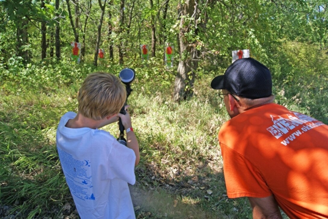 A child takes aim at the Paint Ball Trail during the Outdoor Kansas for Kids event Sept. 8 and 9 at John Redmond Reservoir, near Burlington, Kansas. The annual free event is intended to expose kids to outdoor activities they might not otherwise have the opportunity to experience.