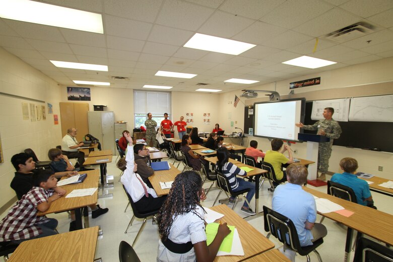 Lt. Col. Robert Haupt, deputy district commander, provides an overview of the mission of Norfolk District, US Army Corps of Engineers, during a STEM session to the sixth- and seventh-grade students at Corporate Landing Middle School in Virginia Beach, Va. The team's focus was to attract yound minds to pursue career fields in science, technology, engineering and mathematics. 