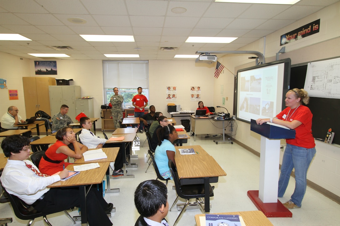 Nicole Woodward focuses on science during a STEM session to the sixth- and seventh-grade students at Corporate Landing Middle School in Virginia Beach, Va. The team's focus was to attract yound minds to pursue career fields in science, technology, engineering and mathematics. 