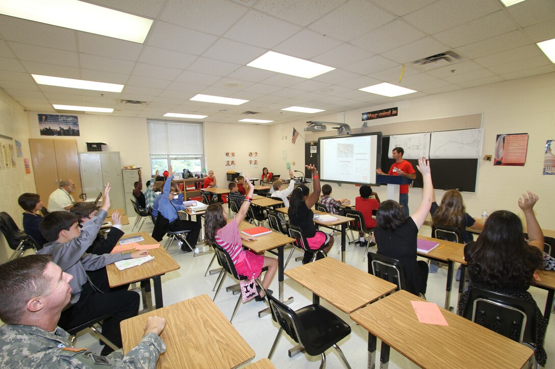 Josh Williams focuses on technology during a STEM session to the sixth- and seventh-grade students at Corporate Landing Middle School in Virginia Beach, Va. The team's focus was to attract yound minds to pursue career fields in science, technology, engineering and mathematics.