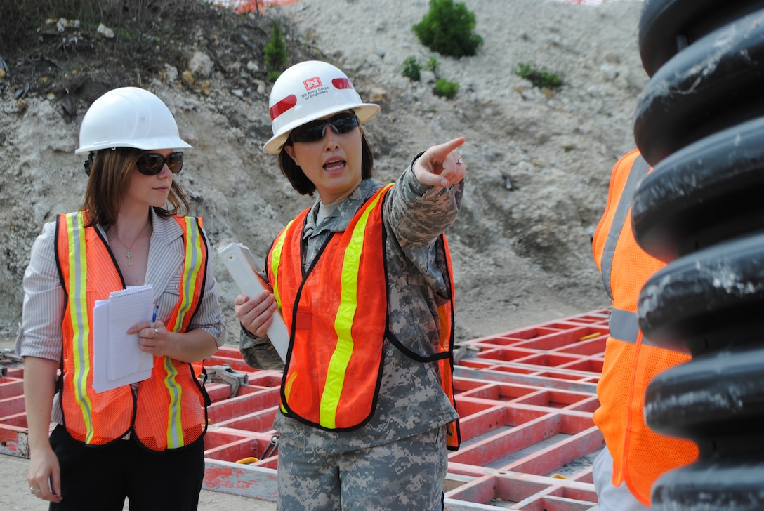 Capt. Erica Lager (right), project manager, directs construction activities on site at the Picayune Strand Merritt Canal Pump Station, the first project to begin construction under the Comprehensive Everglades Restoration Plan. 