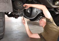 Cpl. Brian R. Carter repairs a tactical vehicle at Camp Kinser Oct. 1. Carter helps
maintain III Marine Expeditionary Force’s mission readiness by conducting intermediate
maintenance on III MEF vehicles. Carter is an automotive maintenance technician with
3rd Maintenance Battalion, Combat Logistics Regiment 35, 3rd Marine Logistics Group, III
MEF.