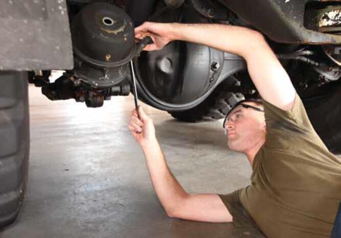 Cpl. Brian R. Carter repairs a tactical vehicle at Camp Kinser Oct. 1. Carter helps
maintain III Marine Expeditionary Force’s mission readiness by conducting intermediate
maintenance on III MEF vehicles. Carter is an automotive maintenance technician with
3rd Maintenance Battalion, Combat Logistics Regiment 35, 3rd Marine Logistics Group, III
MEF.