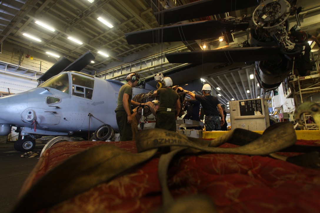 USS IWO JIMA, U.S. 5th Fleet Area of Responsibility (Sept 22, 2012) -Marines from the airframes section of Marine Medium Tiltrotor Squadron 261 (Reinforced), 24th Marine Expeditionary Unit, conduct engine maintenance on an MV-22B Osprey in the hangar of USS Iwo Jima (LHD 7), Sept 22, 2012. The aviation maintenance crews work around the clock to ensure the 24th MEU's aircraft are always ready to fly in support of the various missions they could be called for. The 24th MEU is deployed with the Iwo Jima Amphibious Ready Group as a theater reserve and crisis response force for U.S. Central Command in the U.S. Navy's 5th Fleet area of responsibility. (U.S. Marine Corps photo by Lance Cpl. Tucker S. Wolf)