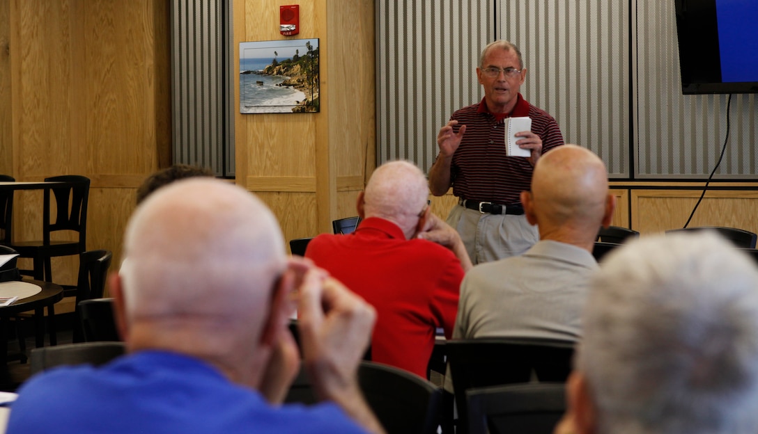 Paul W. O’Toole, a retired Col. and chairman of the retiree counsel, speaks with retirees about news in the community at the quarterly retiree town hall meeting at the Naval Hospital aboard Marine Corps Base Camp Lejeune Sept 21. Leaders from the hospital attended the town hall meeting to help educate and answer any questions the retirees had.