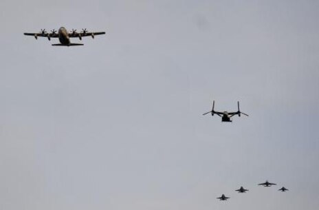 U.S. Marine Corps aircraft perform a flyover during the Marine Aviation Centennial observance at the Marine Corps War Memorial in Arlington, Va., May 16, 2012. 

