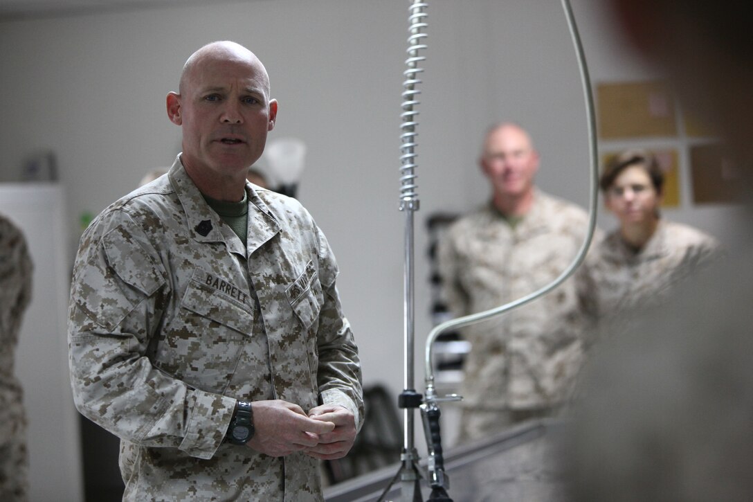 Sergeant Major of the Marine Corps Michael P. Barrett speaks with Personnel Retrieval Platoon (PRP), 2d Marine Logistics Group Forward (2d MLG Fwd), on Camp Bastion, Helmand Province, Afghanistan, September 23, 2011. The Commandant and Sergeant Major of the Marine Corps visit with PRP to commend their work during Operation Enduring Freedom, supporting International Security Assistance Force (ISAF) operations. (U.S. Marine Corps photo by Cpl. Michael Augusto/Released)