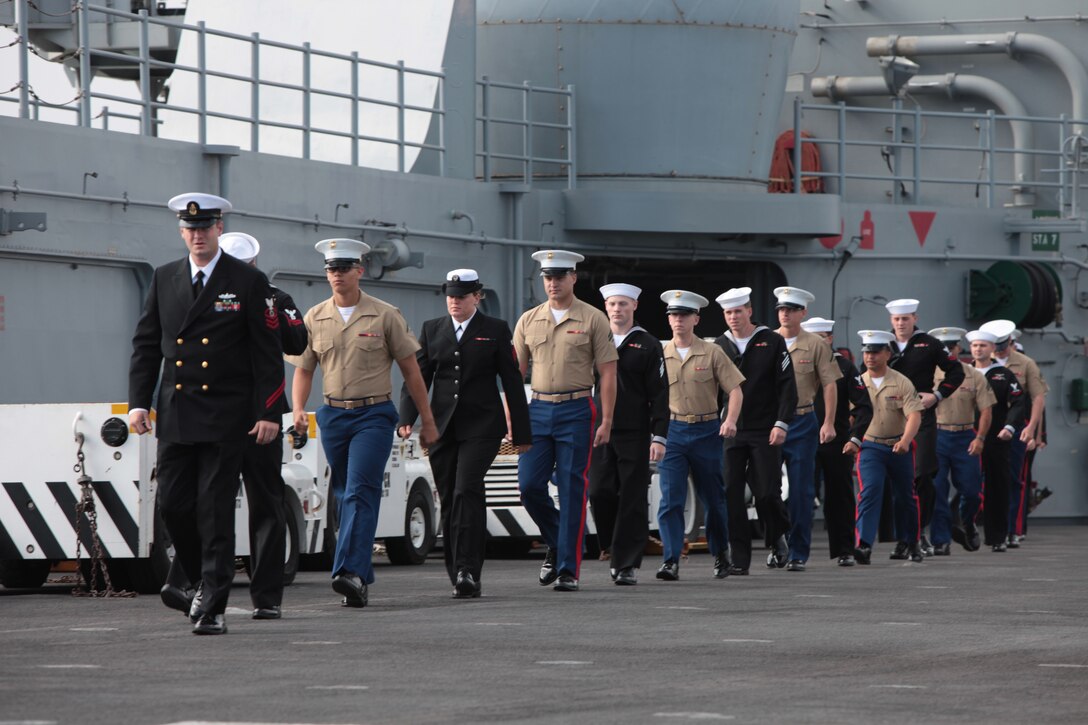 121003-M-OH054-030
SAN FRANCISCO – Marines and Sailors with the 13th Marine Expeditionary Unit march onto the flight deck of the USS Makin Island (LHD-8) as they man the rails for their arrival at San Francisco for the 2012 Fleet Week, Oct. 3, 2012. From Oct. 3-8, Marines and Sailors of the 13th MEU, I Marine Expeditionary Brigade, will participate in numerous community outreach events including the Italian Heritage Day parade, urban search and rescue demonstration, park restoration projects and hospital visits. 
 (Official U.S. Marine Corps photo by Sgt. Christopher O’Quin/Released)
