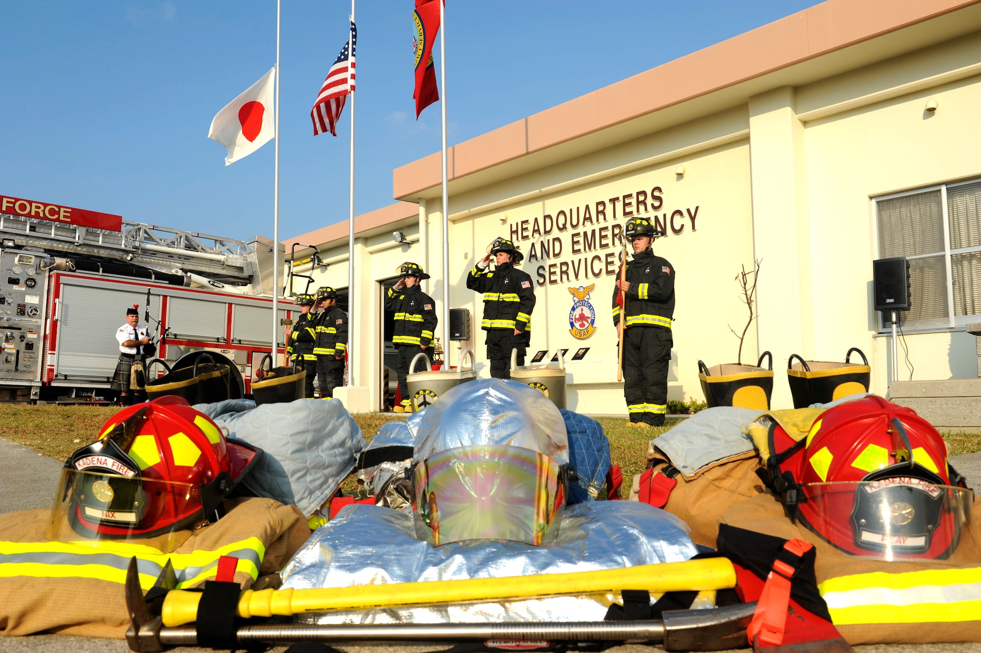 Members of the Kadena Fire Emergency Services Honor Guard salute the colors during the Bells Across America Fallen Firefighters ceremony on Kadena Air Base, Japan, Oct. 7, 2012. Bells Across America began in 2011 as a joint venture between fire departments and their respective houses of worship to honor firefighters who paid the ultimate sacrifice in 2010. Kadena adds one of their own to the National Fallen Firefighter Memorial in Emmitsburg, Maryland, along with more than 80 fallen firefighters who paid the ultimate sacrifice in 2011. (U.S. Air Force photo/Airman 1st Class Hailey R. Davis)
