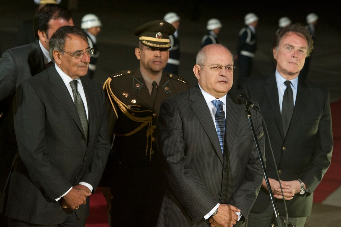 U.S. Defense Secretary Leon E. Panetta listens to Peruvian Minister of Defense Pedro Cateriano Bellido greet the press upon Panetta's arrival in Lima, Peru, Oct. 5, 2012.