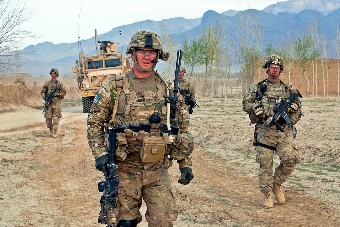 U.S. Army 2nd Lt. Jared Dudley leads fellow soldiers back to Forward Operating Base Warrior from a combined mission with Afghan policemen during a weapons cache search of a compound in southern Ghazni province, Afghanistan, April 8, 2012. Dudley is assigned to the 82nd Airborne Division’s 1st Brigade Combat Team.