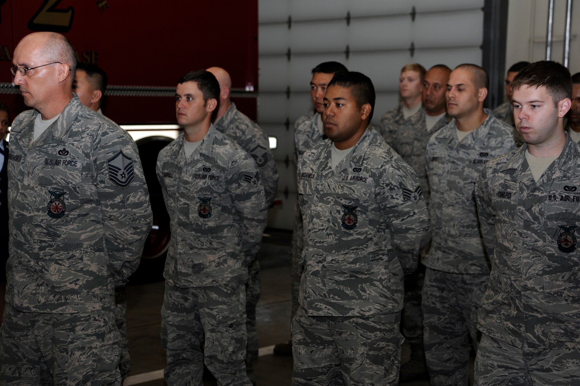 Members of the 35th Civil Engineer Squadron stand in formation during the Bells Across America Memorial Service, part of the National Fallen Firefighter Memorial Weekend, at Misawa Air Base, Japan, Oct. 7, 2012. The moment of remembrance can occur at any time during Memorial Weekend. (U.S. Air Force photo/Tech. Sgt. Marie Brown)