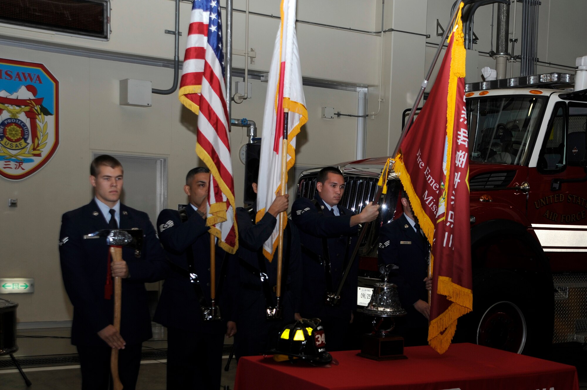 The Misawa Air Base Fire Department Color Guard post the colors during the Bells Across America Memorial Service, part of the National Fallen Firefighter Memorial Weekend, at Misawa Air Base, Japan, Oct. 7, 2012. The ceremony honored 85 fallen firefighters that are being inducted onto the National Fallen Firefighter Monument. (U.S. Air Force photo/Tech. Sgt. Marie Brown)
