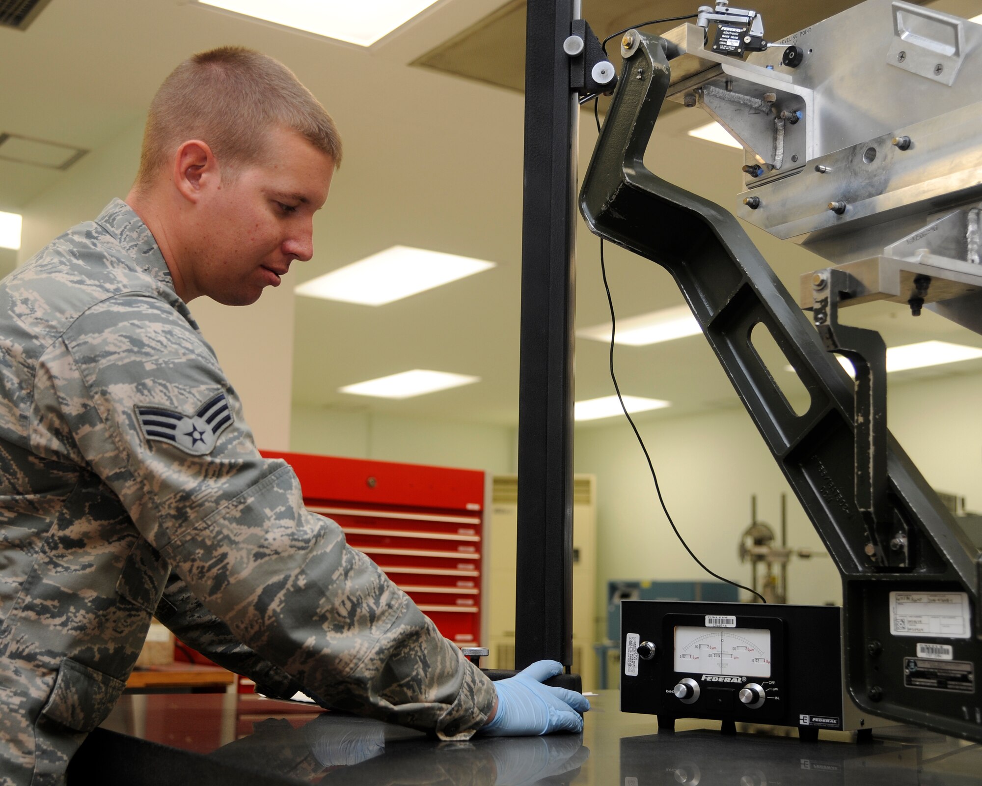 Senior Airman Mitchell Hess, 8th Maintenance Squadron, precision measurement equipment laboratory technician, calibrates an AFT bore-sight fixture using an electronic height gauge at Kunsan Air Base, Republic of Korea, Oct. 3, 2012. The gauge, which is calibrated to 5 millionths of an inch, guarantees the equipment used by the aircraft maintenance squadron to align the F-16 Fighting Falcons precision targeting system is accurate. (U.S. Air Force photo/Senior Airman Marcus Morris)