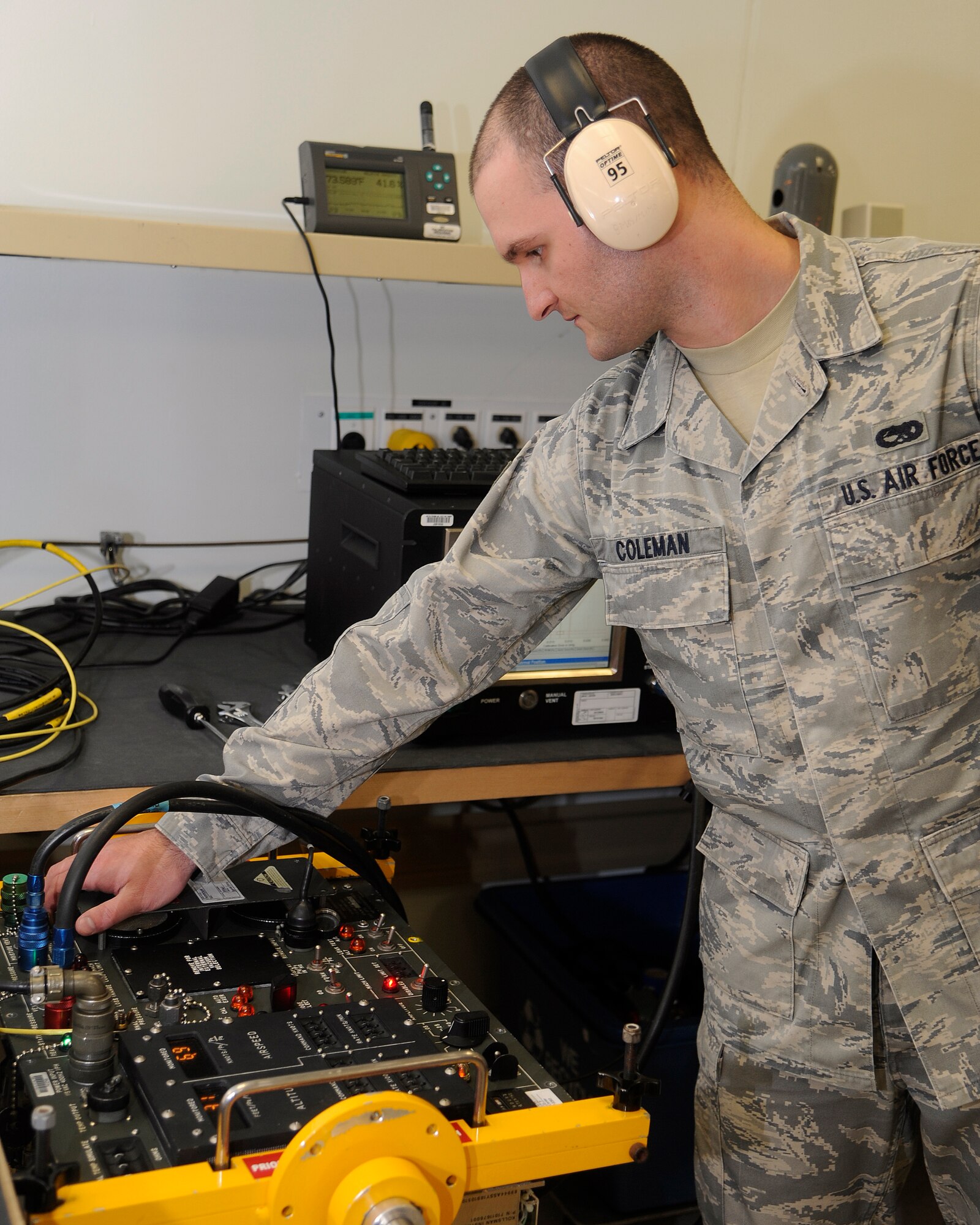 Staff Sgt. Brian Coleman, 8th Maintenance Squadron precision measurement equipment laboratory technician, calibrates a TTU-205J using an Air Data Calibrator at Kunsan Air Base, Republic of Korea, Oct. 3, 2012. The equipment is used by the aircraft maintenance squadron to simulate altitude and flight speed and make sure the F-16 Fighting Falcons are properly calibrated. (U.S. Air Force photo/Senior Airman Marcus Morris)