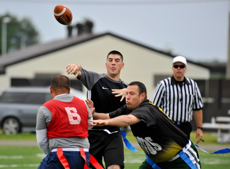 Jacob Lucarelli, 35th Communications Squadron quarterback, throws the ball downfield during his team’s first game of the intramural flag football season at Misawa Air Base, Japan, Oct. 6, 2012. Intramural flag football is the first sport to be played on the new artificial turf field and will continue through Nov. 29, 2012. (U.S. Air Force photo by Airman 1st Class Zachary Kee)
