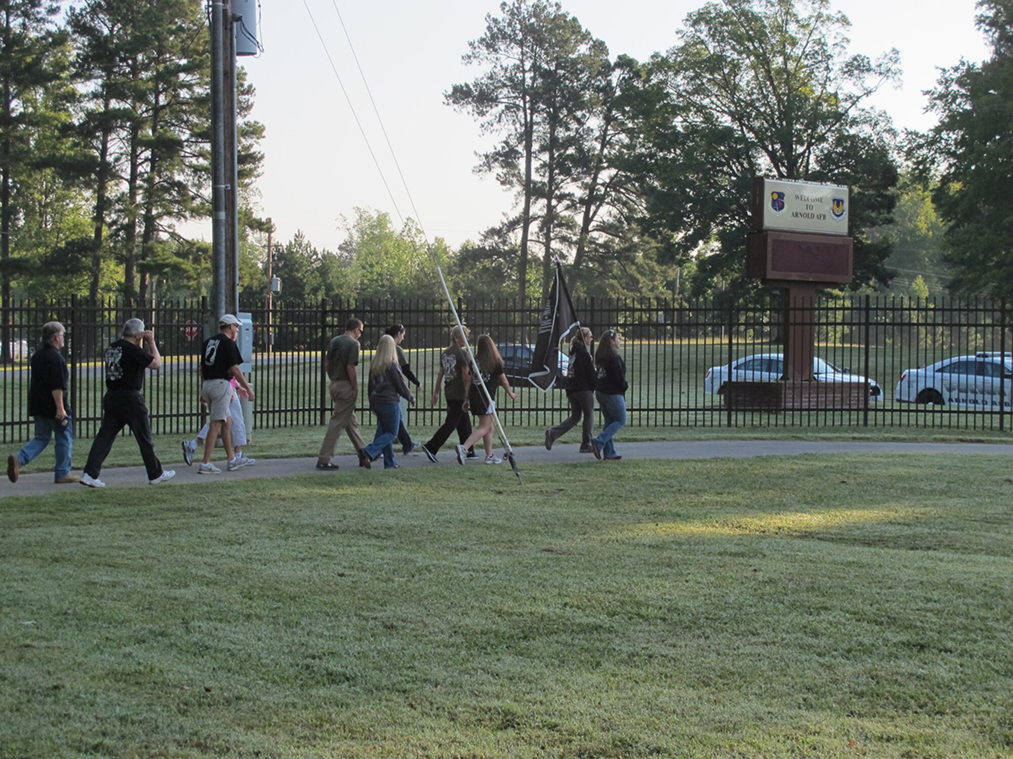 AEDC employees walked around the Arnold Village walking trail at AEDC with Sara Rozell leading the group and carrying the POW/MIA flag in observance of National POW/MIA Recognition Day. (Photo provided by Charlie Jenkins)