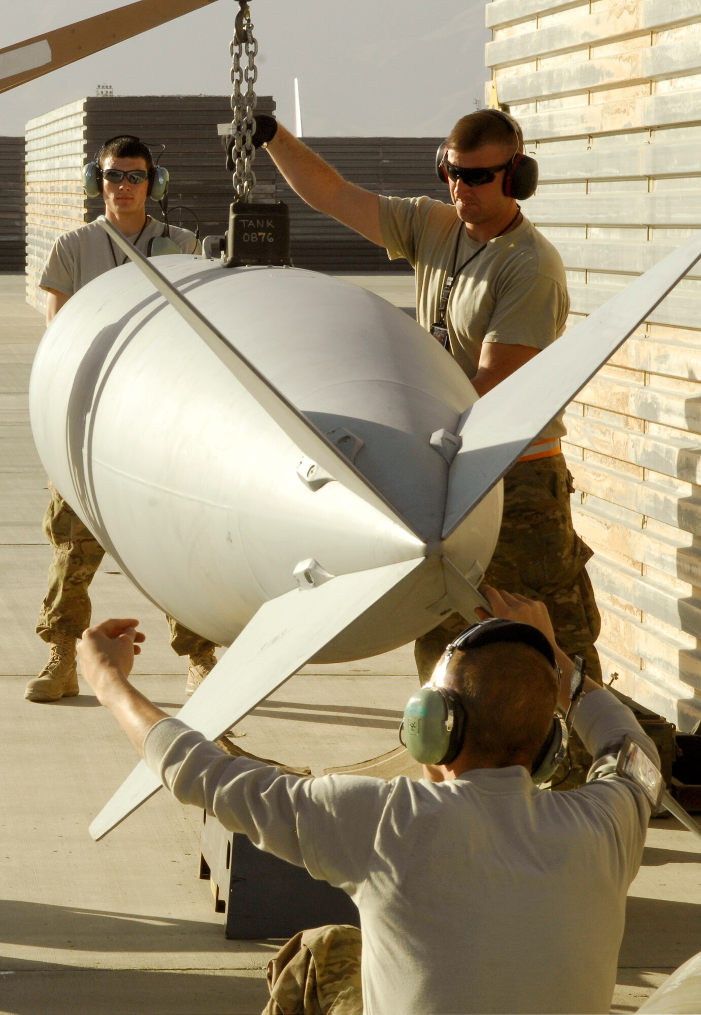 Weapons loaders from the 455th Expeditionary Aircraft Maintenance Squadron prepares to arm a newly arrived A-10 Thunderbolt II from Davis-Monthan Air Force Base’s 354th Fighter Squadron at Bagram Airfield, Afghanistan, Oct. 4, 2012. Davis-Monthan pilots and maintainers are among the newest members of the 455th Air Expeditionary Wing. (U.S. Air Force photo/Staff Sgt. Jeff Nevison)