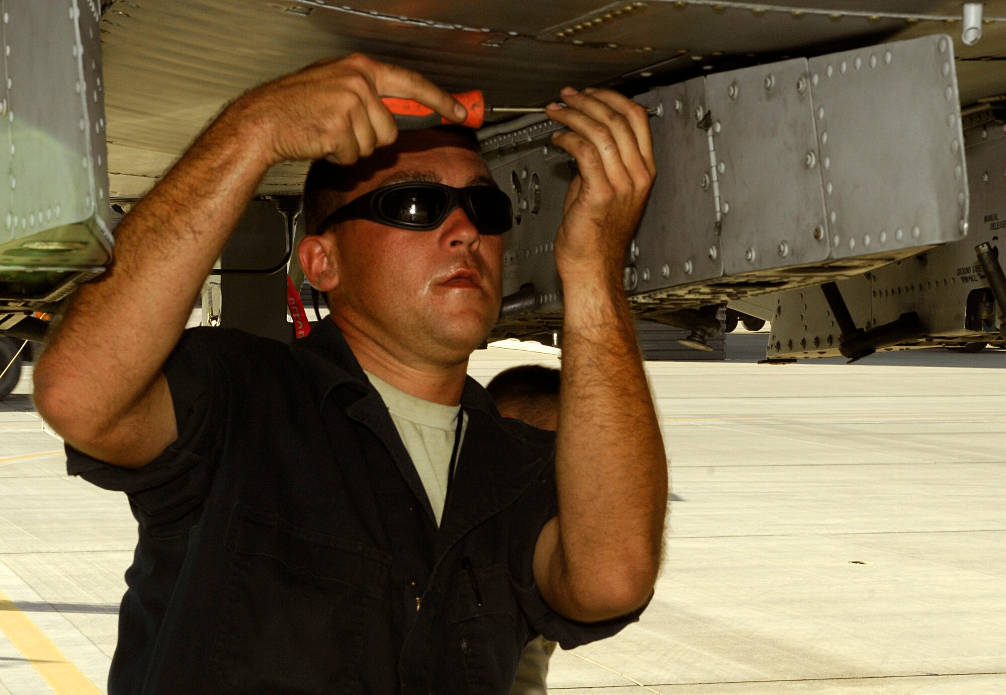 A weapons loader from the 455th Expeditionary Aircraft Maintenance Squadron prepares to arm a newly arrived A-10 Thunderbolt II from Davis-Monthan Air Force Base’s 354th Fighter Squadron at Bagram Airfield, Afghanistan, Oct. 4, 2012. Davis-Monthan pilots and maintainers are among the newest members of the 455th Air Expeditionary Wing. (U.S. Air Force Photo/Staff Sgt. Jeff Nevison)