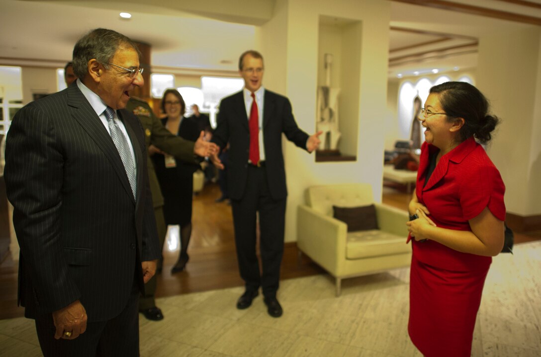 U.S. Defense Secretary Leon E. Panetta sings happy birthday along with his staff to Carrie Kagawa, a member of the the secretary's advance travel staff, in Punta Del Este, Uruguay, Oct. 7, 2012. 
